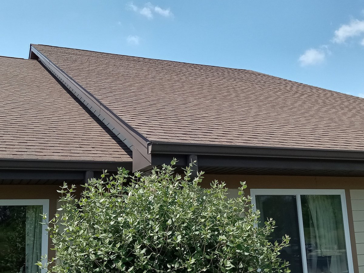 Completed residential roofing work on a home exterior
